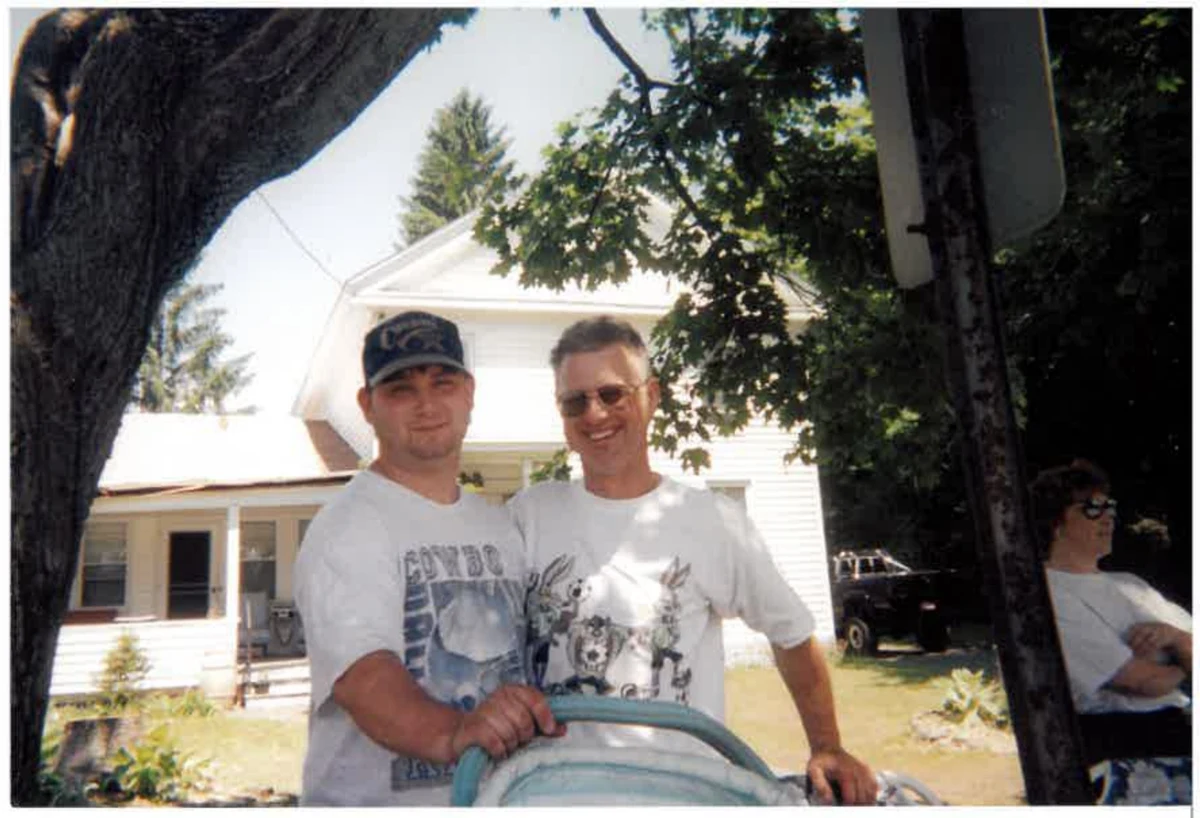 An older family photograph of two people together outdoors