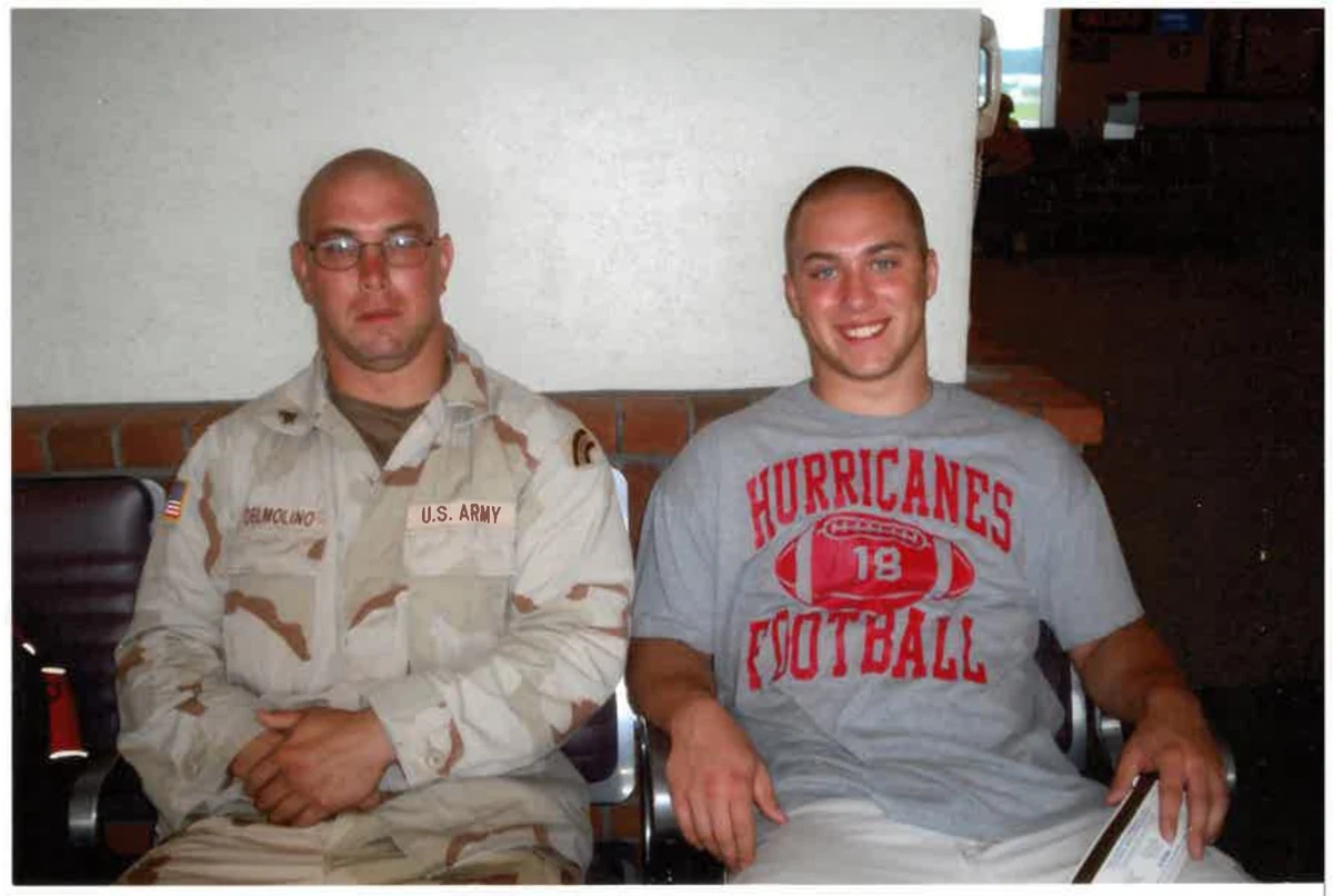 Two people seated together, one wearing a U.S. Army uniform