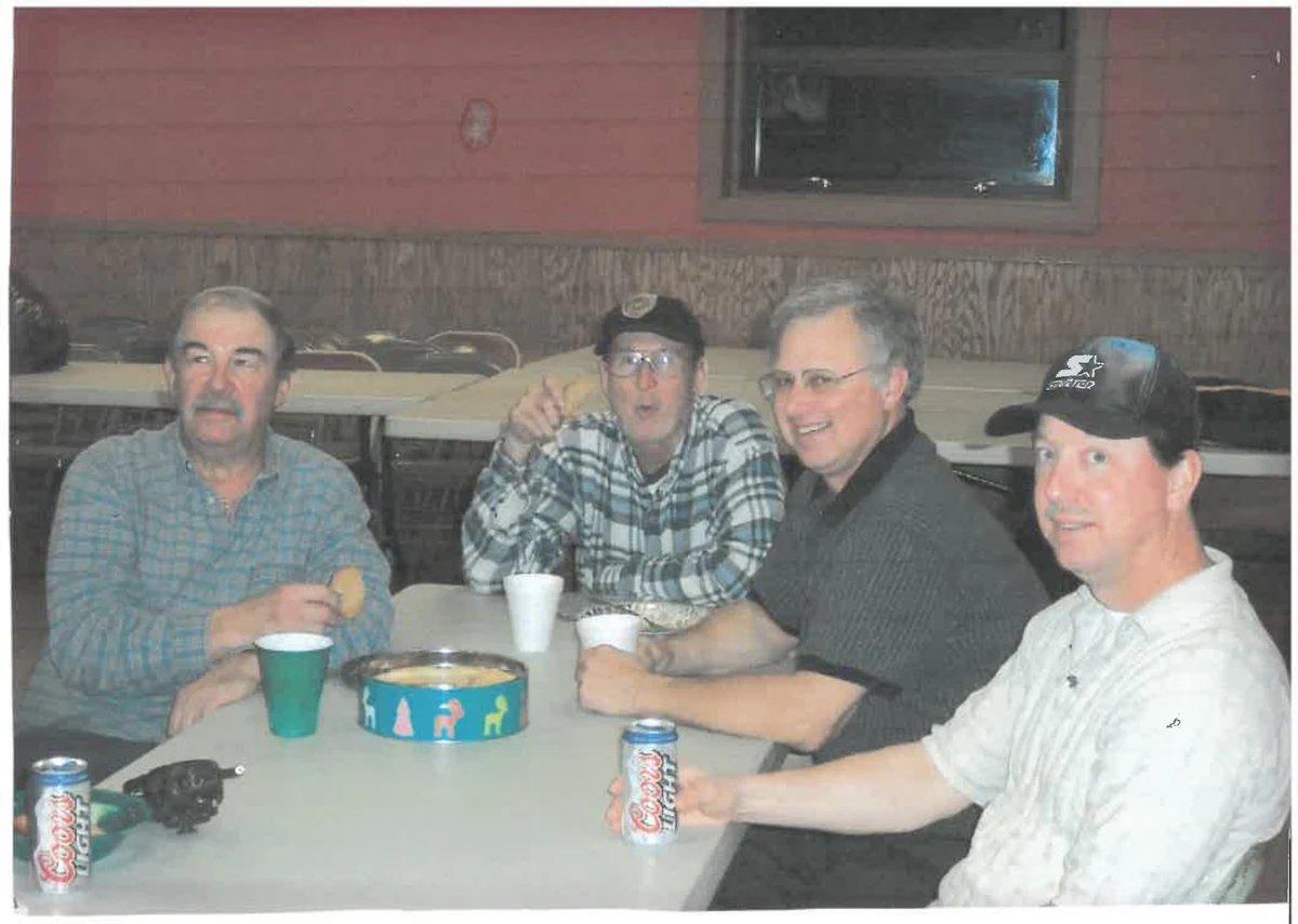 Four people gathered around a table