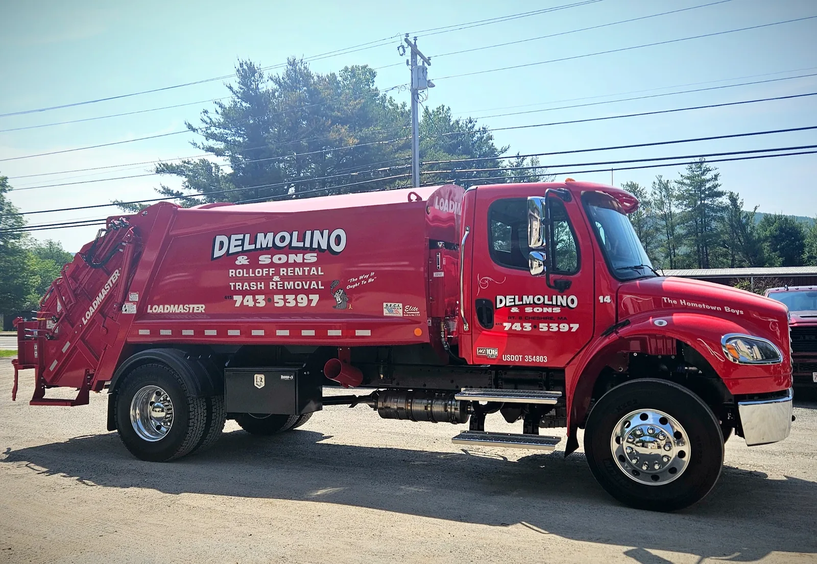 Red Delmolino & Sons trash collection truck